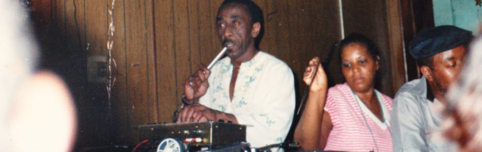 Grand dad DJing at the Club bar, Mamare helping him select records